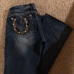 Women’s miss me mid rise boot cut jeans